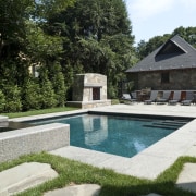 View of outdoor pool area with water feature backyard, estate, garden, home, house, landscape, landscaping, outdoor structure, property, real estate, swimming pool, villa, water feature, yard, white