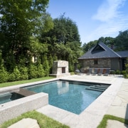 View of outdoor pool area with water feature architecture, backyard, estate, home, house, landscape, landscaping, leisure, outdoor structure, property, real estate, reflection, residential area, sky, swimming pool, tree, villa, water, water feature, yard, teal