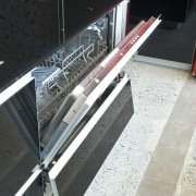 View of kitchen which features integrated Smeg dishwasher architecture, floor, glass, handrail, black, white