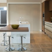 View of a kitchen designed by Suyin of cabinetry, countertop, floor, flooring, home, interior design, kitchen, real estate, room, tile, gray, brown