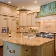 View of a kitchen and dining area with cabinetry, countertop, cuisine classique, home, interior design, kitchen, real estate, room, orange