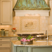 View of a kitchen and dining area with cabinetry, countertop, cuisine classique, flooring, home, interior design, kitchen, living room, room, wall, orange, brown