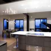 View of an apartment kitchen with dark-toned cabinetry, countertop, interior design, kitchen, room, black, gray