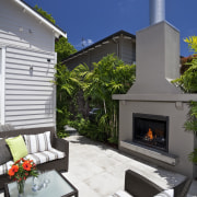 View of outdoor entertainment area, with pool, spa, backyard, estate, home, house, interior design, living room, outdoor structure, patio, real estate, gray