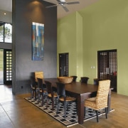 View of a dining room which features wall ceiling, chair, dining room, floor, flooring, furniture, hardwood, interior design, living room, real estate, room, table, wood flooring, brown