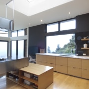 Raised floor kitchen. Stainless steel Binova cooktop. American architecture, cabinetry, countertop, daylighting, interior design, kitchen, window, white