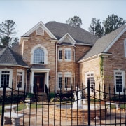 VIew of home built to reflect the style building, cottage, estate, facade, historic house, home, house, mansion, neighbourhood, property, real estate, residential area, roof, siding, suburb, window, gray, white