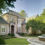 VIew of home built to reflect the style building, cottage, estate, facade, historic house, home, house, landscaping, manor house, mansion, property, real estate, residential area, stately home, tree, villa