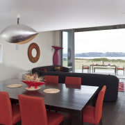 View of red, black and white beach house apartment, architecture, dining room, house, interior design, living room, property, real estate, room, table, gray