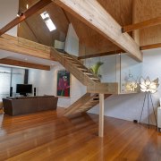 View of bathroom suite with angled openings - architecture, attic, beam, ceiling, daylighting, floor, flooring, furniture, hardwood, home, house, interior design, laminate flooring, living room, loft, plywood, stairs, table, wood, wood flooring, brown