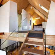 View of bathroom suite with angled openings - architecture, beam, ceiling, daylighting, floor, flooring, handrail, hardwood, home, house, interior design, loft, real estate, stairs, wood, white, brown, orange