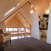 View of bathroom suite with angled openings - architecture, attic, beam, ceiling, daylighting, estate, floor, flooring, hardwood, home, house, interior design, laminate flooring, living room, loft, property, real estate, room, wall, wood, wood flooring, orange, gray