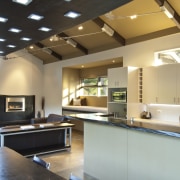 View of rural home with open plan lounge architecture, ceiling, countertop, daylighting, floor, flooring, interior design, lighting, black