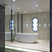 View of bathroom at the Pececnik apartment which architecture, bathroom, ceiling, daylighting, floor, flooring, glass, interior design, plumbing fixture, room, tile, gray