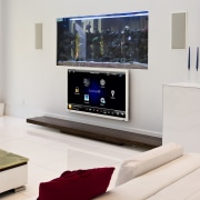 View of the Tran Residence which features home furniture, interior design, living room, media, multimedia, product design, room, table, television, white