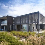 Contemporary beach house. Open-plan living - Contemporary beach architecture, building, corporate headquarters, facade, home, house, property, real estate, sky, white
