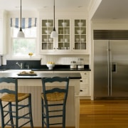 View of kitchen with light-toned cabinets and dark-toned cabinetry, ceiling, countertop, cuisine classique, dining room, floor, flooring, hardwood, home, interior design, kitchen, laminate flooring, room, wood flooring, brown, gray