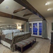 View of home with Tudor-style elements, wood fireplace bedroom, ceiling, estate, interior design, real estate, room, gray, black