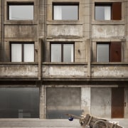 View of a contemporary boutique hotel in Shanghai. architecture, building, door, facade, house, wall, window, gray