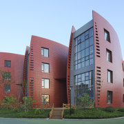 View of Dalian Preschool, with curvilinear forms and apartment, architecture, building, campus, commercial building, condominium, corporate headquarters, daytime, elevation, facade, home, house, metropolitan area, mixed use, neighbourhood, property, real estate, residential area, sky, teal