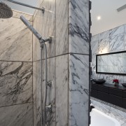 View of bedroom and bathroom with grey, black property, wall, gray