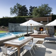 View of a house with landscaped forecourt, pool backyard, estate, leisure, outdoor furniture, outdoor structure, property, real estate, resort, sunlounger, swimming pool, villa, black