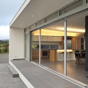 View of contemporary bach with terrace, sheltered courtyard architecture, door, facade, house, real estate, window, gray