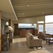 View of the oceanfront Butterfly House in Carmel ceiling, floor, house, interior design, living room, real estate, window, brown