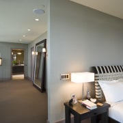 View of contemporary bedroom and bathroom with subdued architecture, ceiling, daylighting, floor, flooring, home, interior design, living room, real estate, room, window, gray