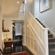 Interior view of traditional style home with white ceiling, daylighting, floor, flooring, handrail, hardwood, home, interior design, living room, real estate, room, stairs, wall, window, wood, wood flooring, orange, gray