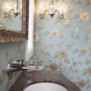 View of bathroom with floral wallpaper and dark-toned bathroom, ceiling, ceramic, floor, flooring, interior design, light fixture, lighting, room, sink, tile, wall, gray