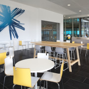 View of the cafe at the new Telecom cafeteria, furniture, interior design, restaurant, table, gray, black