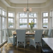 View of casual dining area incorporating a window cabinetry, ceiling, chair, dining room, floor, flooring, furniture, hardwood, home, interior design, living room, room, table, wall, window, wood, wood flooring, gray