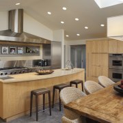 View of kitchen with wooden cabinetry and island cabinetry, countertop, cuisine classique, interior design, kitchen, real estate, room, gray