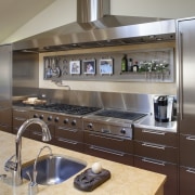 View of stainless steel cabinetry, hood, fridge and cabinetry, countertop, cuisine classique, home appliance, interior design, kitchen, gray, brown