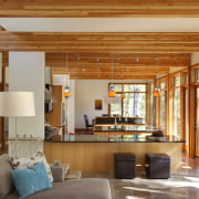 View of sunken open-plan kitchen with wooden cabinetry, beam, ceiling, home, house, interior design, living room, real estate, room, window, brown