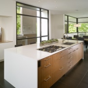 View of island with white countertop, wooden cabinetry cabinetry, countertop, cuisine classique, interior design, kitchen, real estate, room, gray, brown