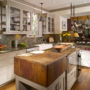 View of remodeled kitchen with rainforest green marble cabinetry, countertop, cuisine classique, hardwood, interior design, kitchen, room, brown, gray