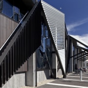 View of folded roof and canopy design at architecture, building, corporate headquarters, facade, house, landmark, structure, black, gray