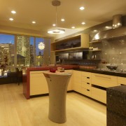 View of a remodeled kitchen with platinum grey cabinetry, ceiling, countertop, flooring, interior design, kitchen, lighting, real estate, room, under cabinet lighting, brown, orange