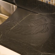 View of remodeled kitchen in a California bungalow, floor, flooring, material, wood, brown, black