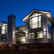 View of the Boathouse, designed to be reminiscent architecture, building, corporate headquarters, cottage, elevation, estate, facade, home, house, lighting, mixed use, property, real estate, residential area, siding, sky, window, blue, black