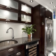 View of kitchen in Art-Deco styled apartment building, cabinetry, countertop, home appliance, interior design, kitchen, gray, black