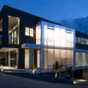 View of the Lite-House on Waiheke Island, a apartment, architecture, building, commercial building, condominium, corporate headquarters, elevation, estate, facade, home, house, mixed use, property, real estate, residential area, sky, window, blue