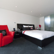 View of bedroom with dark floor , red architecture, bed frame, bedroom, floor, hotel, interior design, real estate, room, suite, white, gray, black