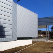 Exterior view of the National Centre for Social architecture, building, commercial building, corporate headquarters, daylighting, facade, headquarters, house, real estate, shed, siding, sky, structure, window, gray, blue