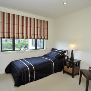 View of a David Reid Homes house with bed frame, bedroom, ceiling, furniture, home, interior design, property, real estate, room, window, window covering, gray