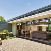 View of indoor/outdoor flow in a renovated period architecture, backyard, courtyard, estate, facade, home, house, property, real estate, residential area, roof, white