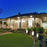 Exterior view of a renovated period home. - backyard, cottage, estate, facade, farmhouse, grass, home, house, landscape, landscaping, lighting, mansion, plant, property, real estate, residential area, sky, villa, yard, blue