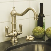 View of contemporary bathroom fixtures. - View of brass, metal, product design, still life photography, tap, white